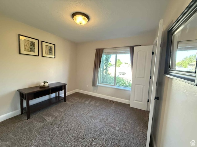 420 N Josephine Ln, Price, UT 84501 - empty room with dark carpet and baseboards