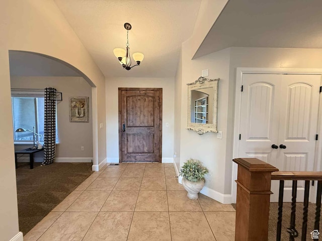 420 N Josephine Ln, Price, UT 84501 - foyer with arched walkways, a chandelier, and light tile patterned floors