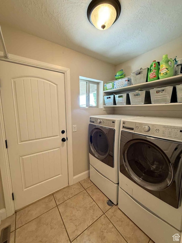 420 N Josephine Ln, Price, UT 84501 - washroom featuring washing machine and dryer, a textured ceiling, and light tile patterned floors