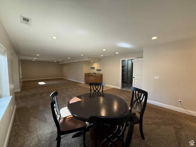 420 N Josephine Ln, Price, UT 84501 - carpeted dining room with a bar and recessed lighting