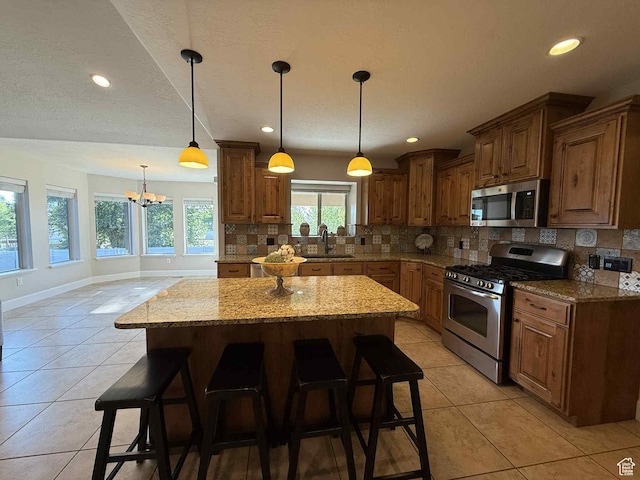420 N Josephine Ln, Price, UT 84501 - kitchen featuring appliances with stainless steel finishes, light tile patterned flooring, tasteful backsplash, light stone counters, and recessed lighting