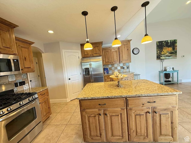 420 N Josephine Ln, Price, UT 84501 - kitchen featuring stainless steel appliances, arched walkways, backsplash, light tile patterned floors, and light stone counters