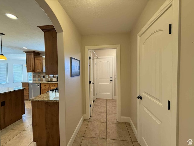 420 N Josephine Ln, Price, UT 84501 - hall featuring arched walkways, light tile patterned flooring, recessed lighting, and a textured ceiling