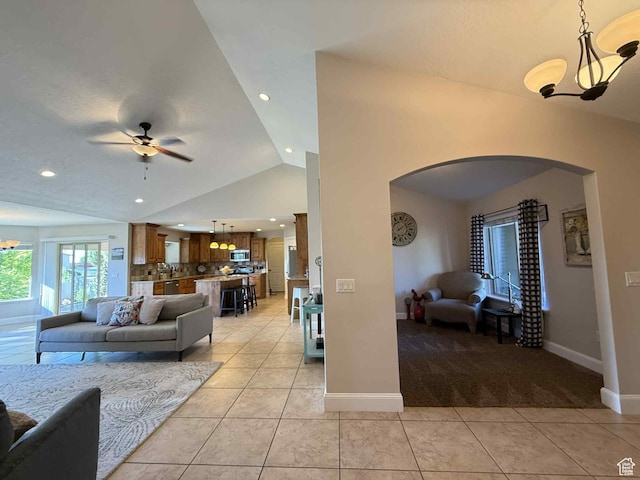 420 N Josephine Ln, Price, UT 84501 - living area featuring arched walkways, ceiling fan, light tile patterned floors, vaulted ceiling, and recessed lighting