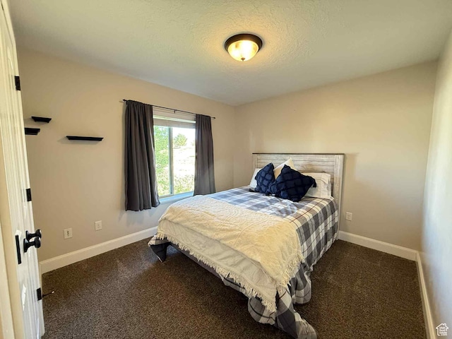 420 N Josephine Ln, Price, UT 84501 - bedroom featuring a textured ceiling and dark carpet
