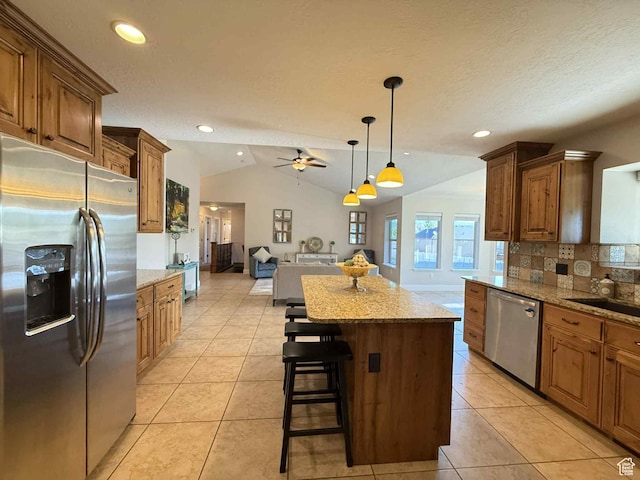 420 N Josephine Ln, Price, UT 84501 - kitchen with stainless steel appliances, open floor plan, tasteful backsplash, a ceiling fan, and a kitchen island