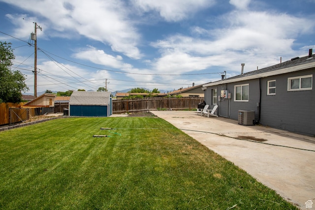 4586 W 4925 S, Kearns, UT 84118 - fenced backyard featuring a patio area and a storage unit