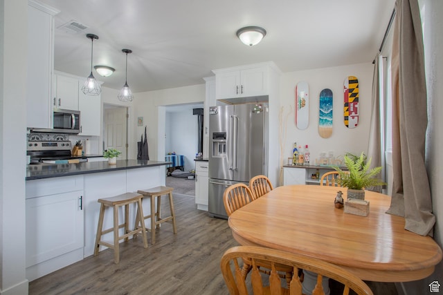 4586 W 4925 S, Kearns, UT 84118 - dining space with dark wood-type flooring