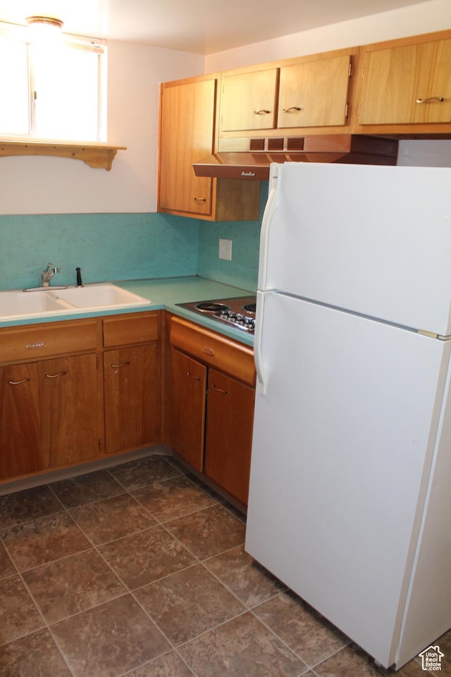 2342 S Van Buren Ave E, Ogden, UT 84403 - kitchen with freestanding refrigerator, electric stovetop, light countertops, and range hood