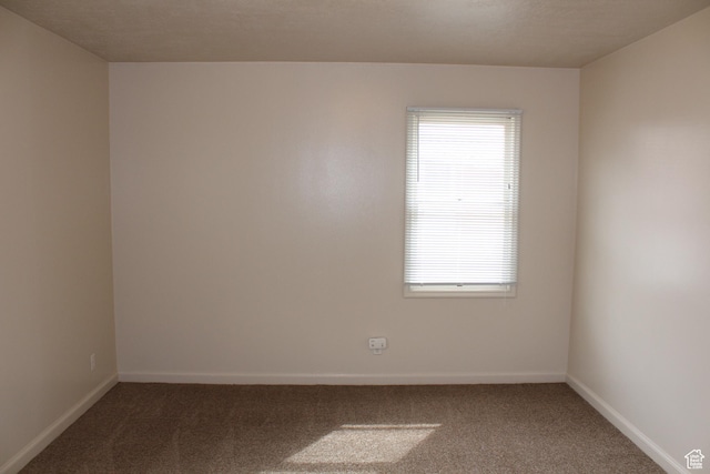 2342 S Van Buren Ave E, Ogden, UT 84403 - empty room featuring carpet floors and healthy amount of natural light