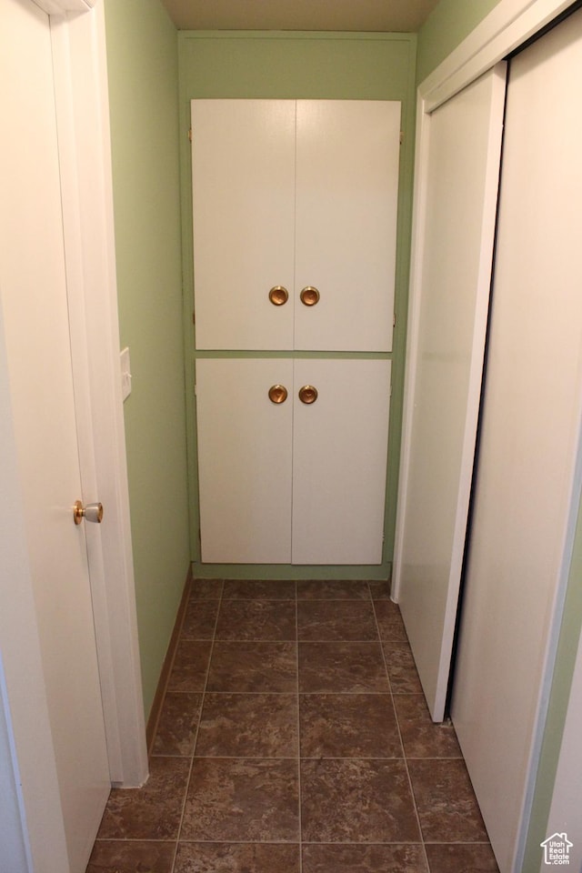 2342 S Van Buren Ave E, Ogden, UT 84403 - hallway featuring dark stone finish floors