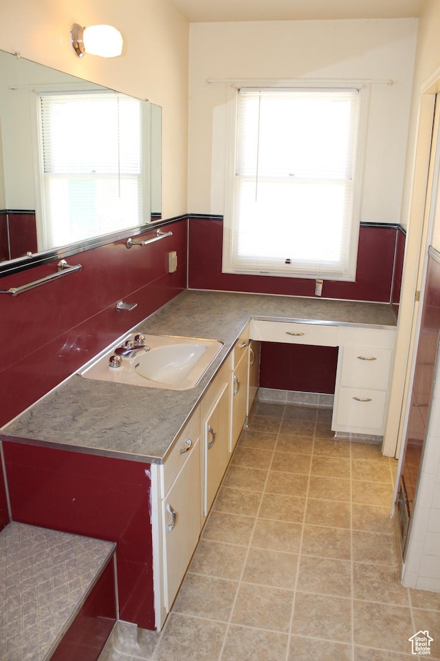 2342 S Van Buren Ave E, Ogden, UT 84403 - bathroom featuring plenty of natural light, vanity, and tile patterned floors