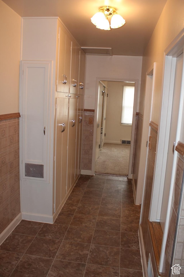 2342 S Van Buren Ave E, Ogden, UT 84403 - corridor featuring baseboards and a wainscoted wall