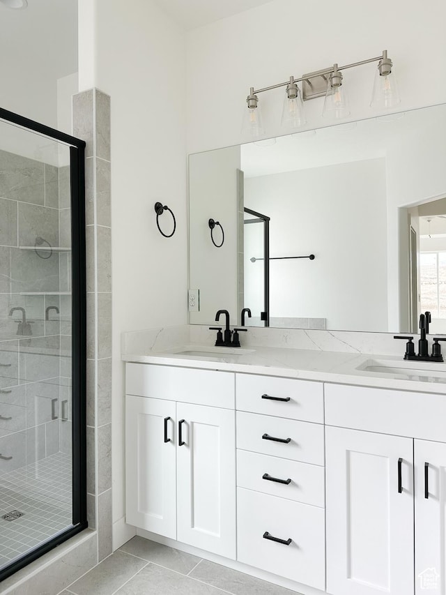6999 W Hazel Oak Ct, Herriman, UT 84096 - bathroom featuring a shower stall, double vanity, and tile patterned flooring