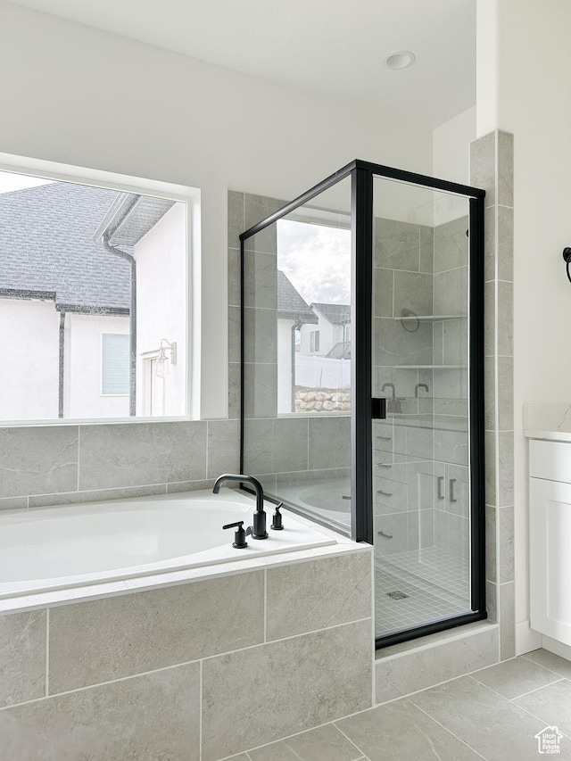 6999 W Hazel Oak Ct, Herriman, UT 84096 - bathroom featuring a garden tub, a stall shower, and tile patterned floors
