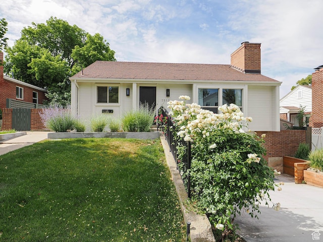 2512 E Redondo Ave S, Salt Lake City, UT 84108 - view of front facade featuring a chimney