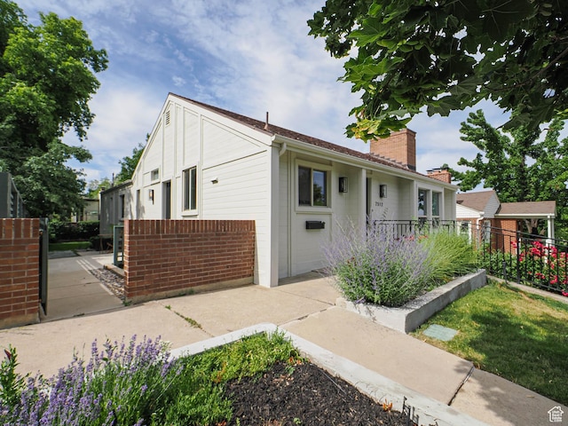 2512 E Redondo Ave S, Salt Lake City, UT 84108 - view of front of home featuring a chimney and brick siding