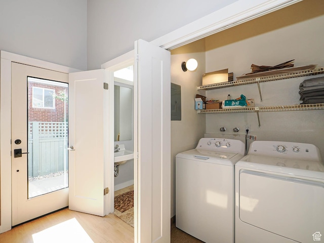2512 E Redondo Ave S, Salt Lake City, UT 84108 - laundry area with washing machine and dryer, light wood-style floors, and electric panel