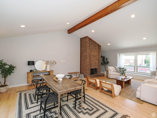 2512 E Redondo Ave S, Salt Lake City, UT 84108 - dining space with light wood-style flooring, a brick fireplace, and recessed lighting