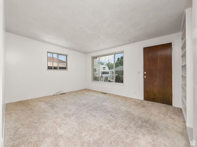 3340 S 2000 W, West Valley City, UT 84119 - carpeted empty room with a textured ceiling