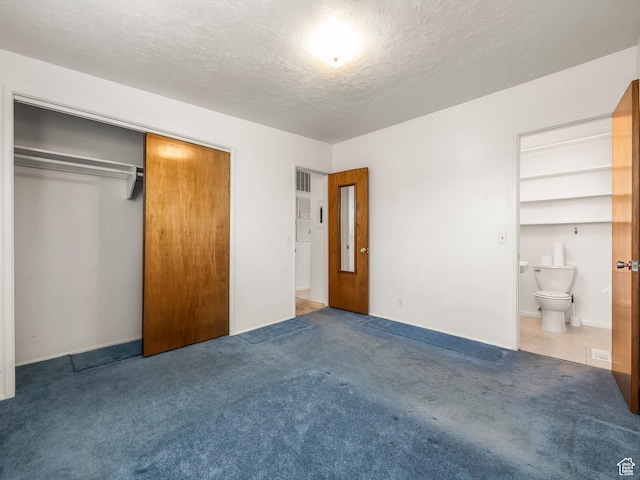 3340 S 2000 W, West Valley City, UT 84119 - unfurnished bedroom with carpet, a textured ceiling, a closet, and connected bathroom
