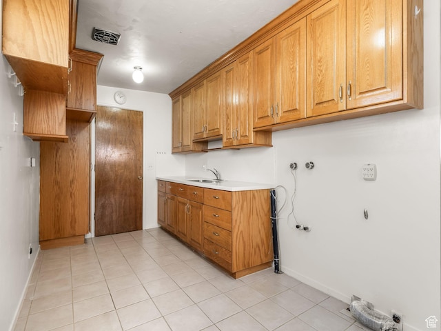 3340 S 2000 W, West Valley City, UT 84119 - laundry room featuring cabinet space, light tile patterned floors, and hookup for a washing machine