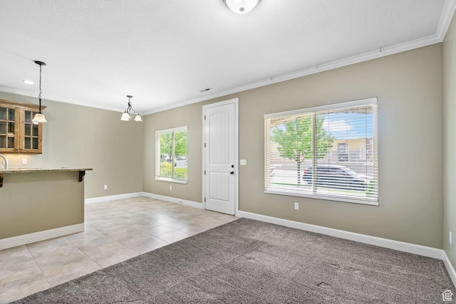 998 W 950 N, Orem, UT 84057 - unfurnished living room featuring crown molding, a chandelier, light tile patterned flooring, and light carpet