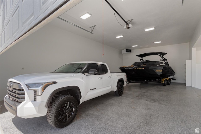 11989 S 3600 W, Riverton, UT 84065 - garage featuring a garage door opener
