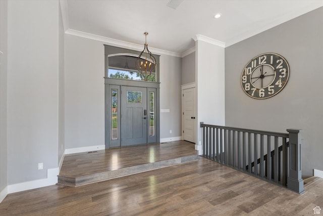11989 S 3600 W, Riverton, UT 84065 - foyer entrance featuring ornamental molding, wood finished floors, a chandelier, and recessed lighting
