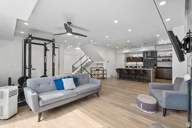 615 E 100 S Unit 1, Salt Lake City, UT 84102 - living room featuring recessed lighting, stairway, light wood finished floors, and a ceiling fan