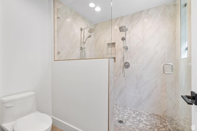 615 E 100 S Unit 1, Salt Lake City, UT 84102 - bathroom featuring tiled shower and recessed lighting
