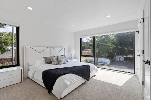 615 E 100 S Unit 1, Salt Lake City, UT 84102 - carpeted bedroom featuring multiple windows, access to exterior, and recessed lighting