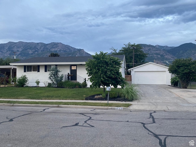 1740 N 1400 W, Provo, UT 84604 - ranch-style home with a mountain view, a front lawn, an outbuilding, and a detached garage