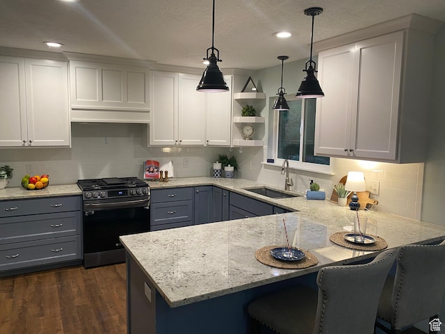 1740 N 1400 W, Provo, UT 84604 - kitchen with stainless steel range with gas cooktop, a peninsula, tasteful backsplash, pendant lighting, and open shelves