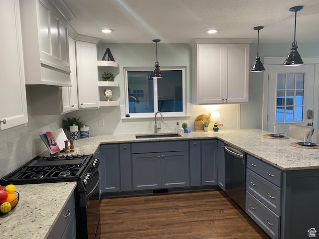 1740 N 1400 W, Provo, UT 84604 - kitchen with black gas range oven, a peninsula, stainless steel dishwasher, tasteful backsplash, and white cabinetry