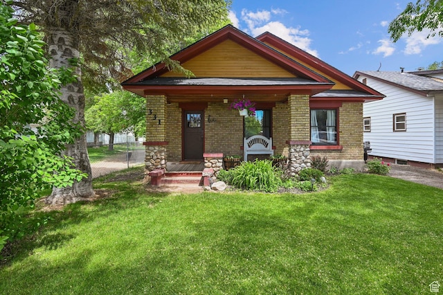 331 Chateau Thierry St, Soda Springs, ID 83276 - craftsman inspired home with brick siding, a porch, and a front yard