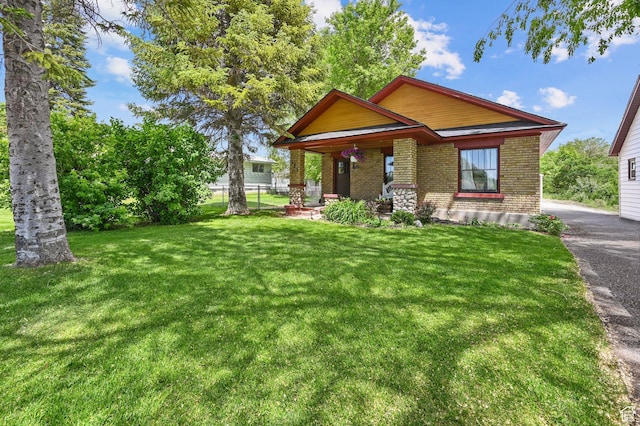 331 Chateau Thierry St, Soda Springs, ID 83276 - view of front facade featuring brick siding and a porch