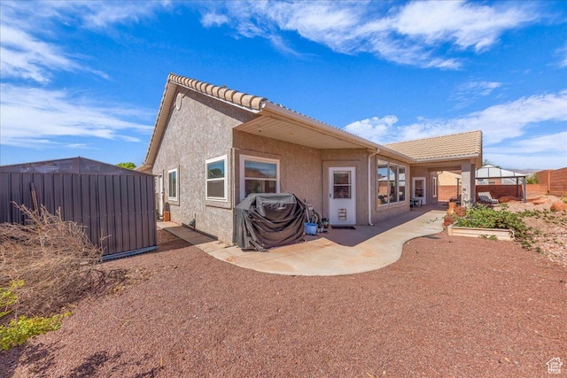 329 E 20 S, Ivins, UT 84738 - rear view of property featuring a patio, stucco siding, and a tile roof