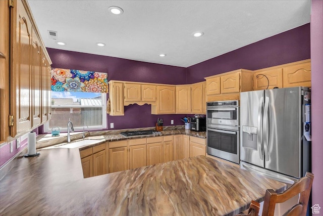 329 E 20 S, Ivins, UT 84738 - kitchen featuring appliances with stainless steel finishes, light brown cabinets, recessed lighting, and a peninsula