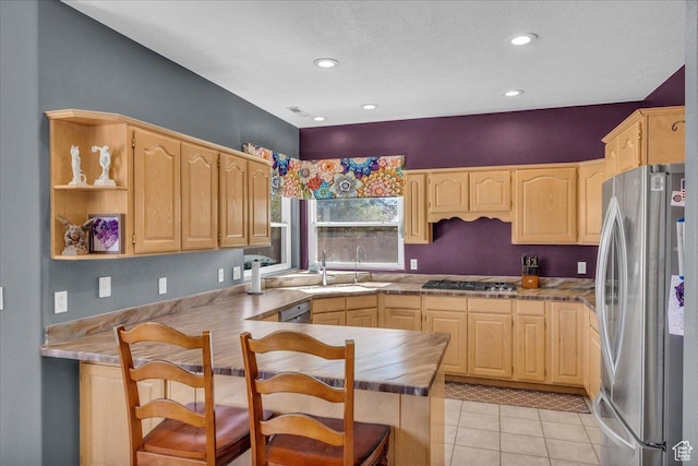 329 E 20 S, Ivins, UT 84738 - kitchen with appliances with stainless steel finishes, light brown cabinets, a peninsula, light tile patterned flooring, and recessed lighting