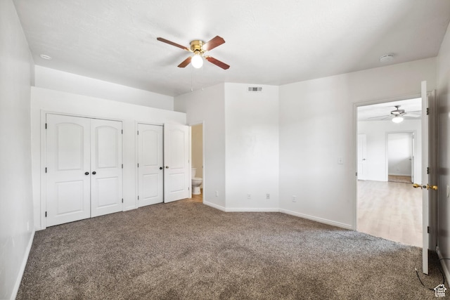 35 E 600 S Unit B202, Ivins, UT 84738 - unfurnished bedroom featuring carpet floors, two closets, and a ceiling fan