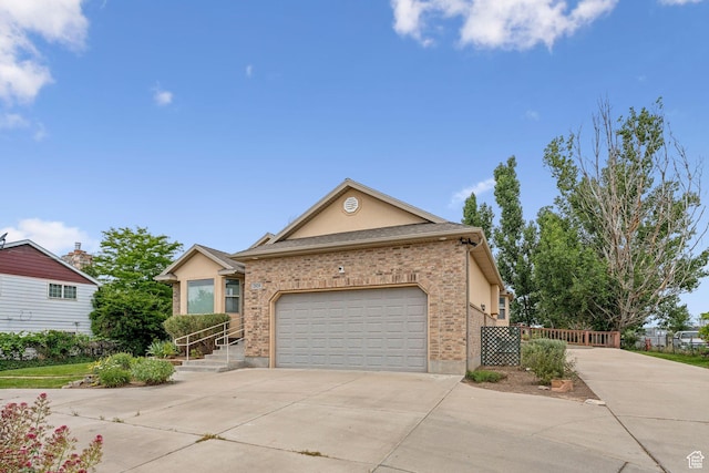2828 W Gentile St, Layton, UT 84041 - ranch-style house with driveway, a garage, and brick siding