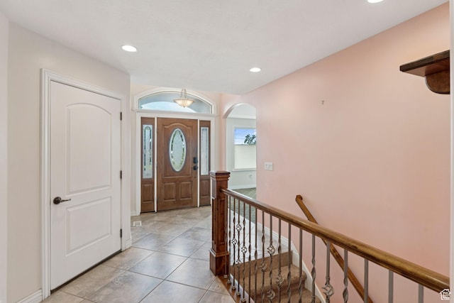 2828 W Gentile St, Layton, UT 84041 - foyer entrance with arched walkways, recessed lighting, light tile patterned flooring, and stairway