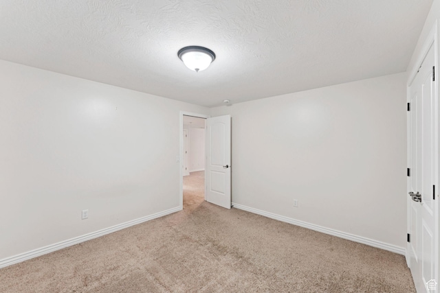 2828 W Gentile St, Layton, UT 84041 - unfurnished bedroom featuring light carpet and a textured ceiling