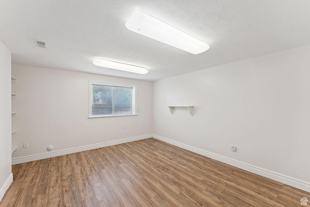 2828 W Gentile St, Layton, UT 84041 - unfurnished room featuring wood finished floors and baseboards