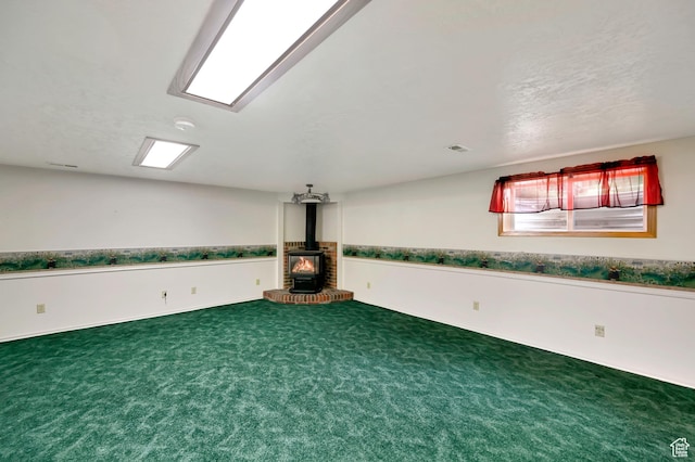 421 S 90 W, Richmond, UT 84333 - carpeted spare room with a wood stove