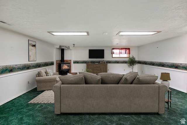421 S 90 W, Richmond, UT 84333 - living area featuring carpet floors, a wood stove, and a textured ceiling