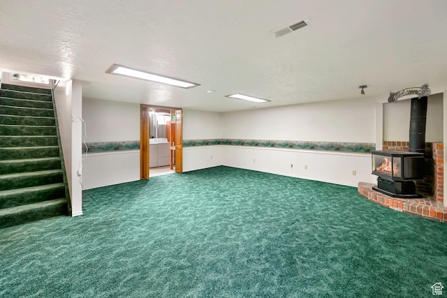 421 S 90 W, Richmond, UT 84333 - finished basement featuring stairs, a wood stove, carpet floors, and washer and clothes dryer