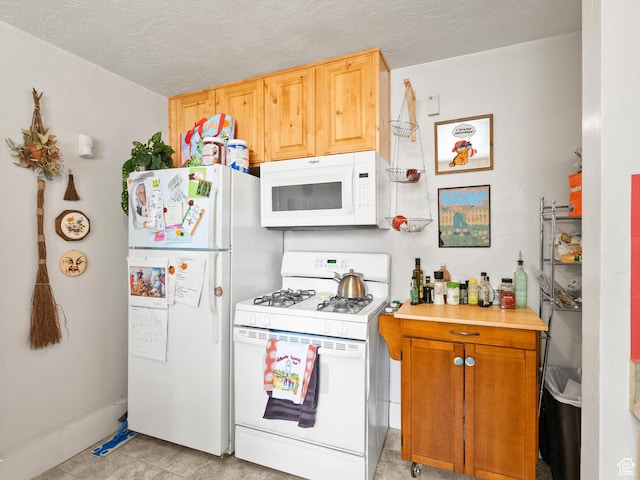509 E 800 S, Salt Lake City, UT 84102 - kitchen featuring white appliances, light countertops, and a textured ceiling