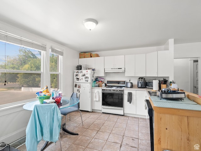 509 E 800 S, Salt Lake City, UT 84102 - kitchen with white appliances, under cabinet range hood, light countertops, white cabinetry, and light tile patterned floors